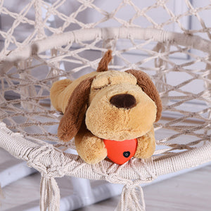 Brown Pawshé HeartNest heartbeat plush resting on a woven chair